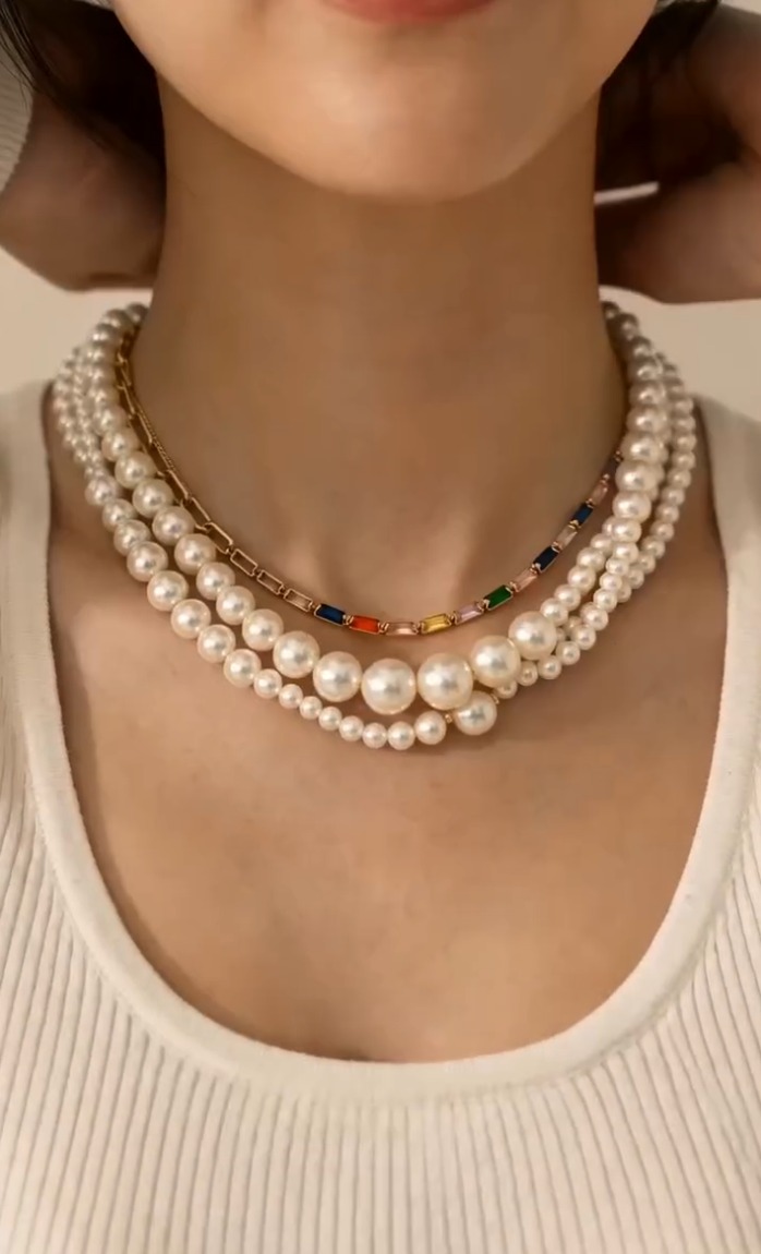 Layered December pearl and enamel chain necklaces